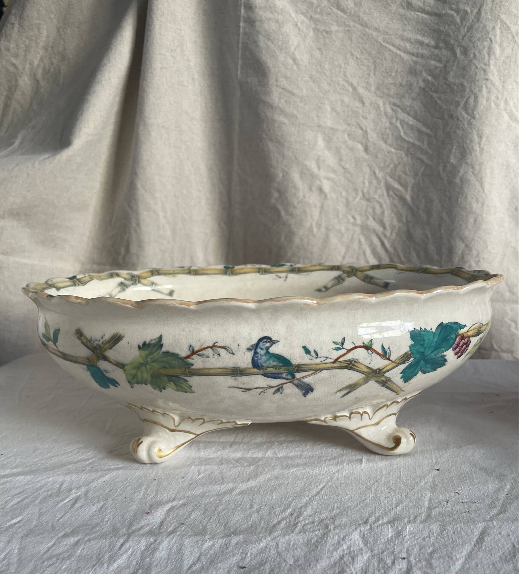 Oval jardinière in earthenware on legs with Japonese motif, birds, leaves.