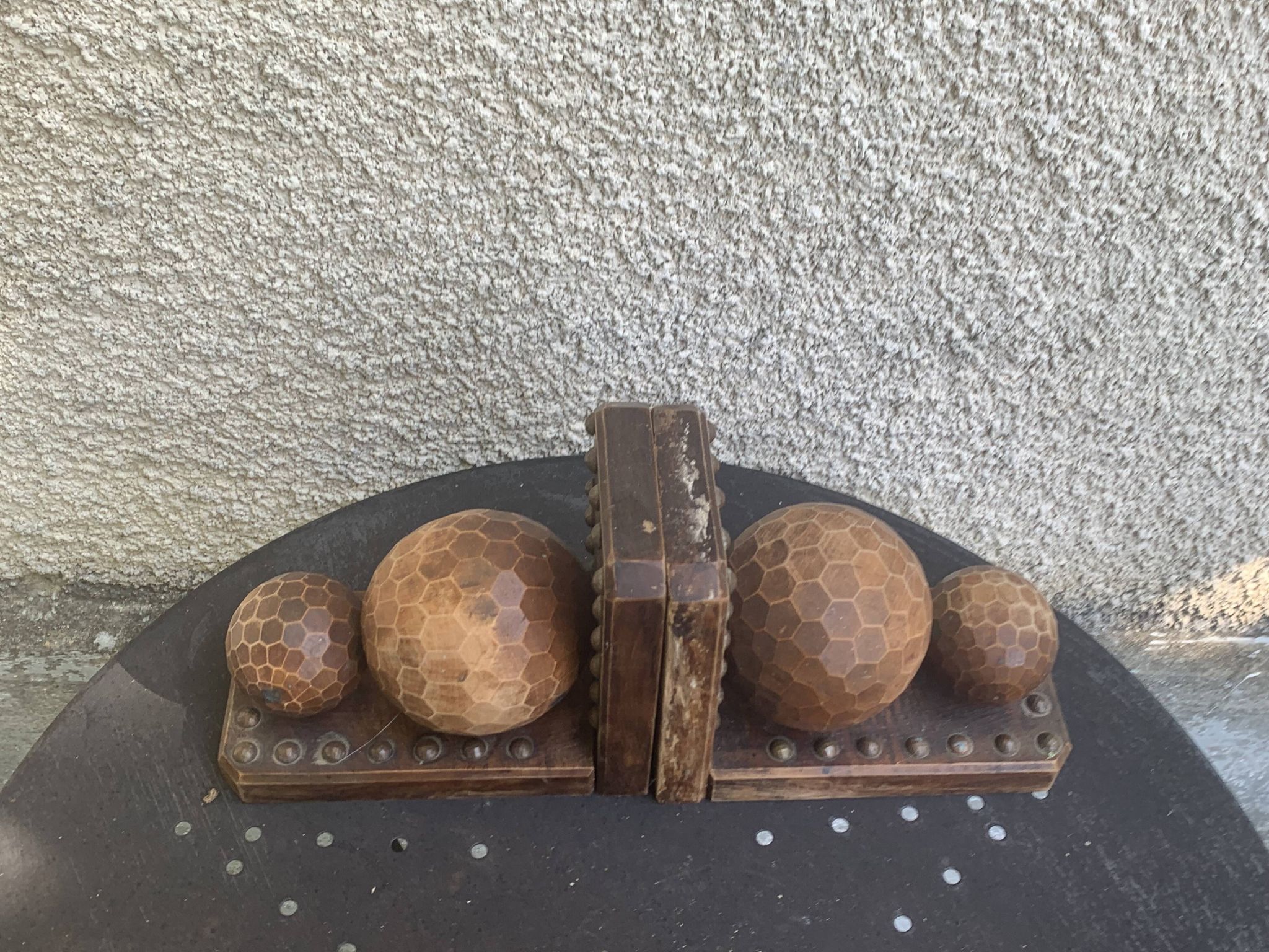 Pair of vintage carved wood and metal ball bookends