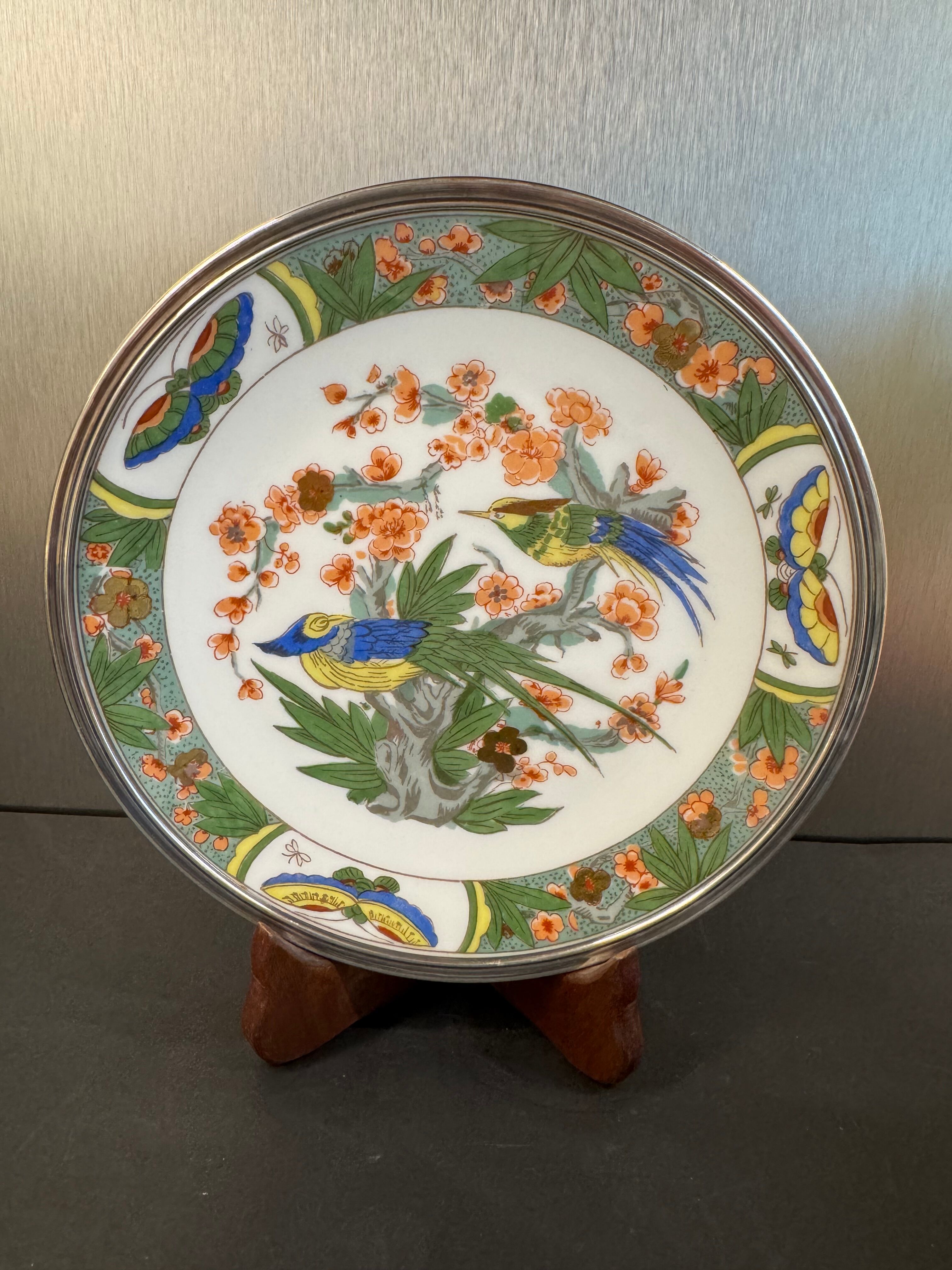 Two Raynaud Limoges plates and Tetard brothers silver.