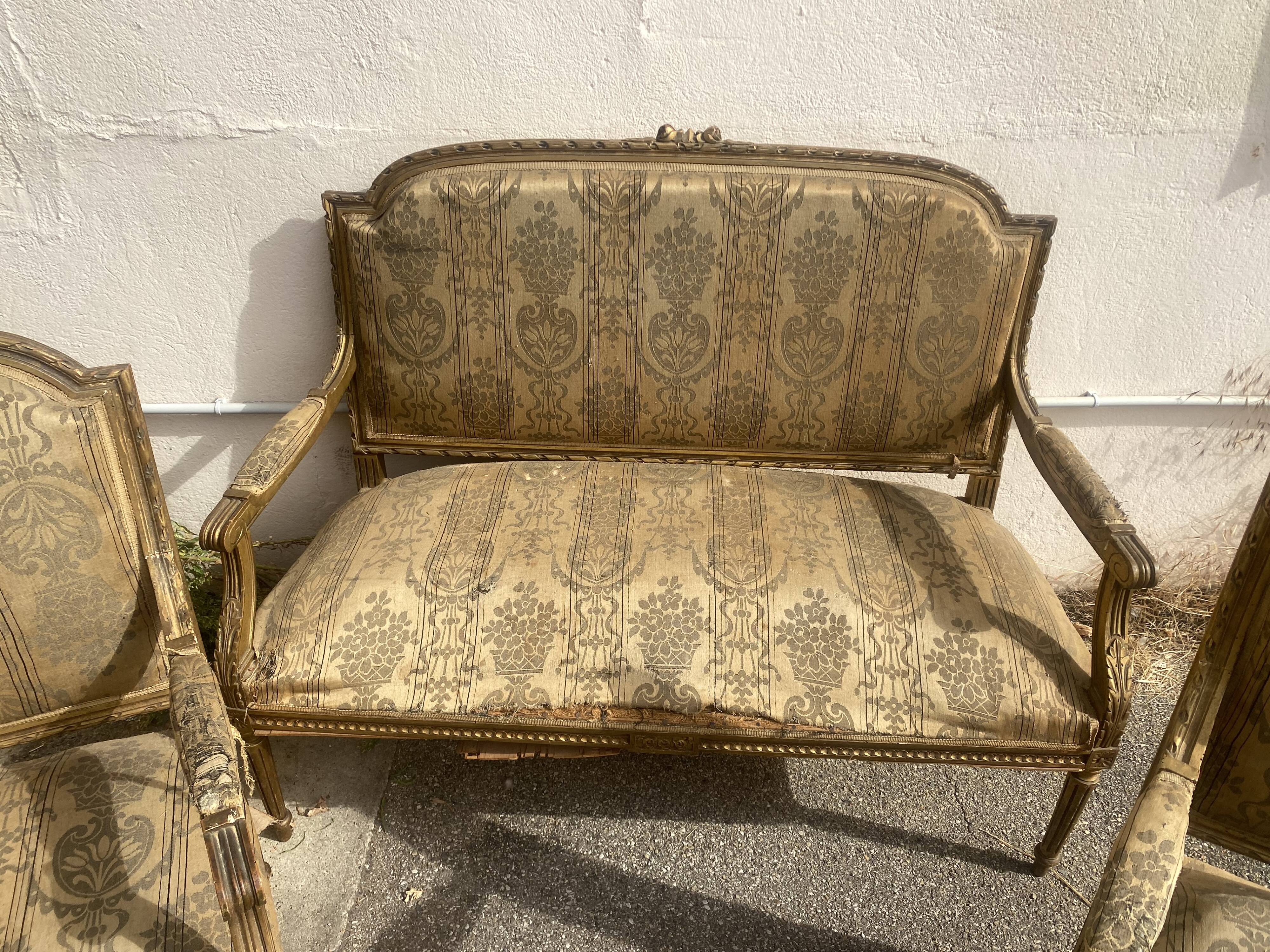 Louis XVI style living room in gilded wood. Napoleon III period