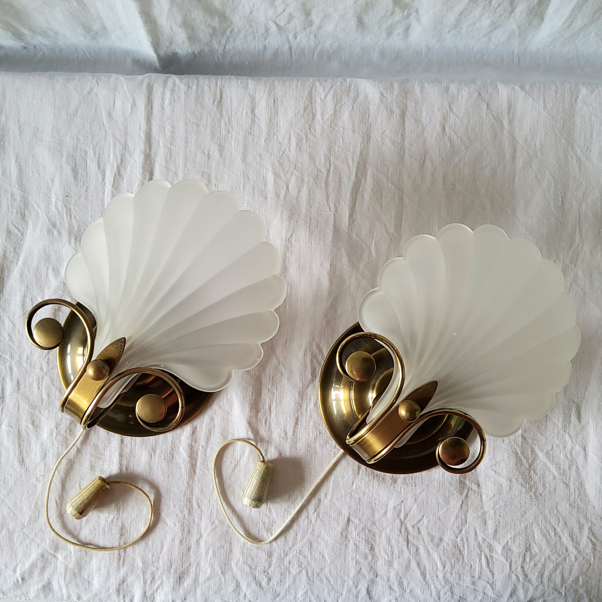 Pair of Deknudt shell sconces