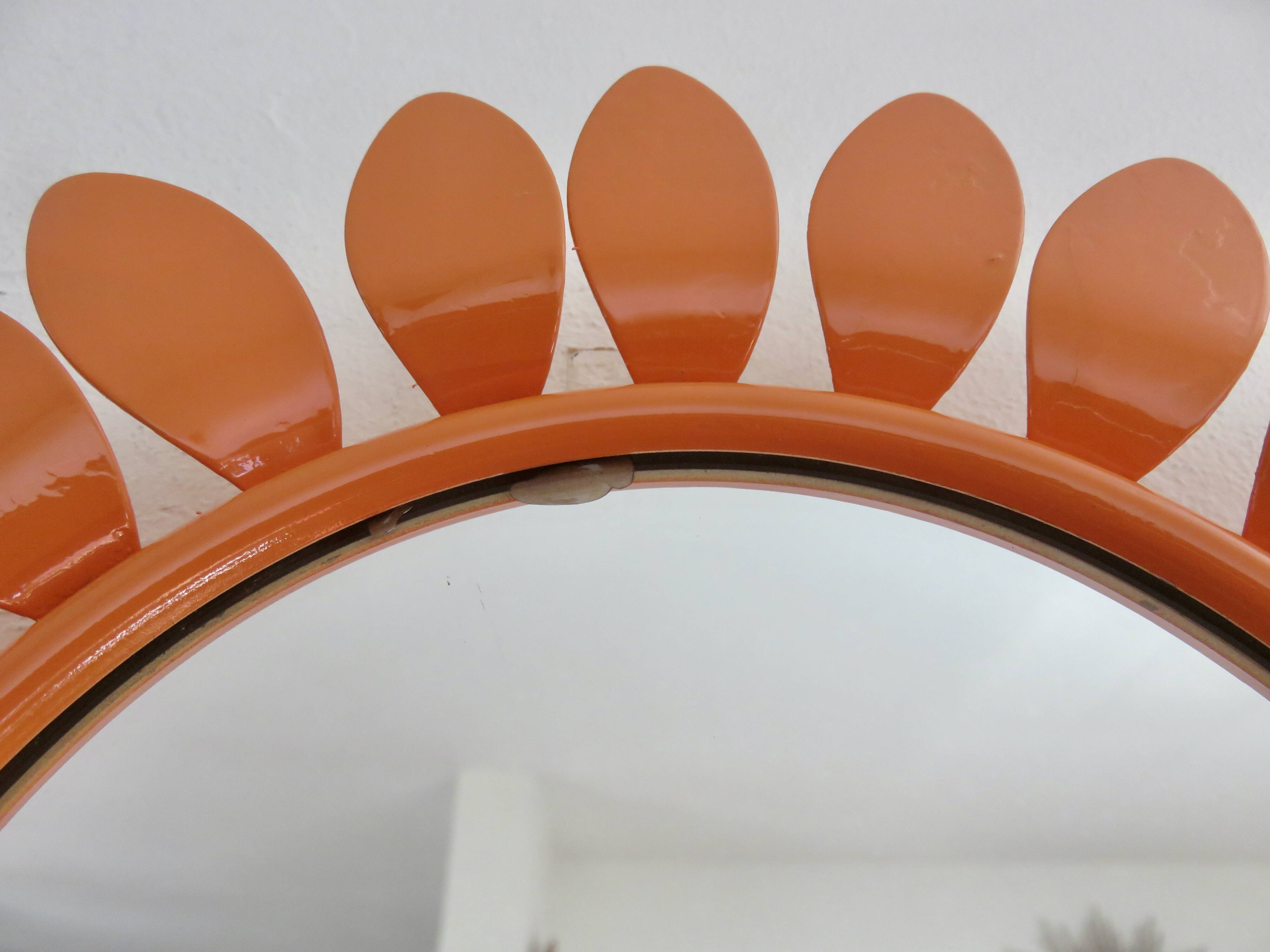 Large 1970s "flower" mirror in orange metal