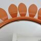 Grand miroir "fleur" 1970 en métal orange