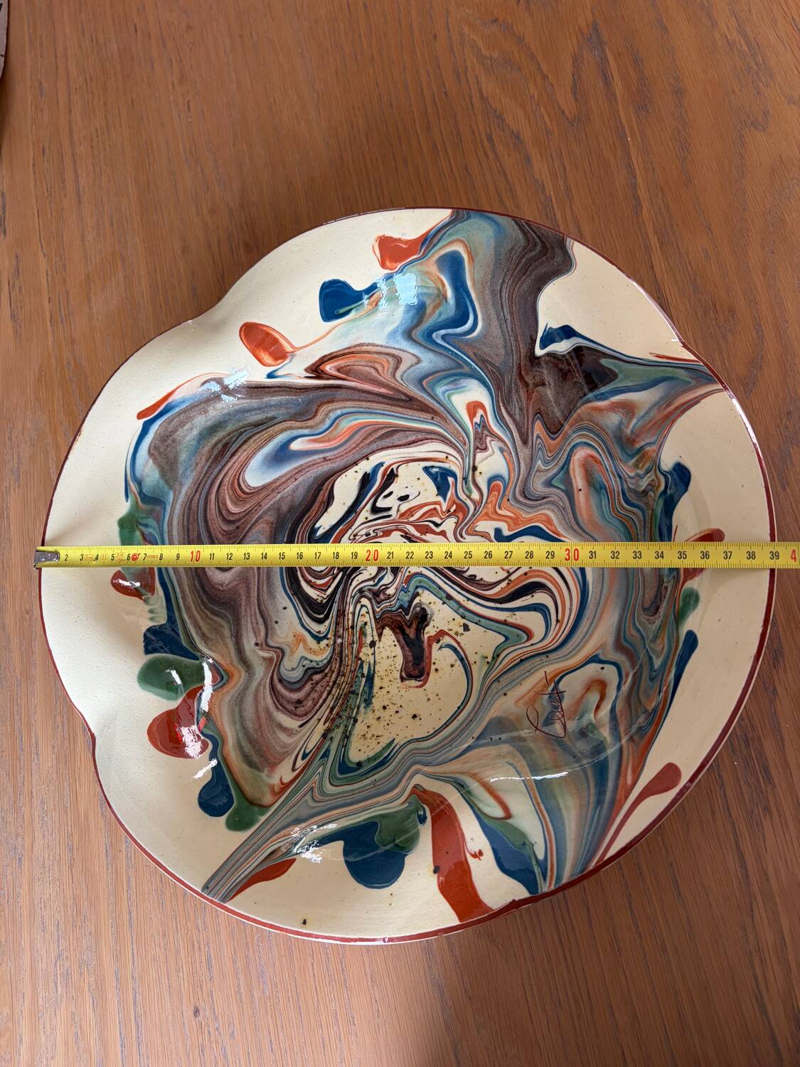 Glazed ceramic plate signed