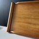 Vintage wooden plateau in Scandinavian style from the 60s — cylindrical handles.