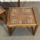 Set of 3 nesting tables in teak with tiled tops.