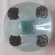 Handcrafted glass fruit bowl with ribbed design set with pewter medallions.