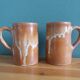2 enameled stoneware mugs cups