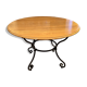 Extendable table in solid oak with wrought iron legs.