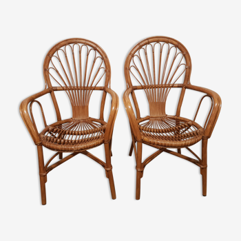 Deux fauteuils en rotin vintage avec accoudoirs