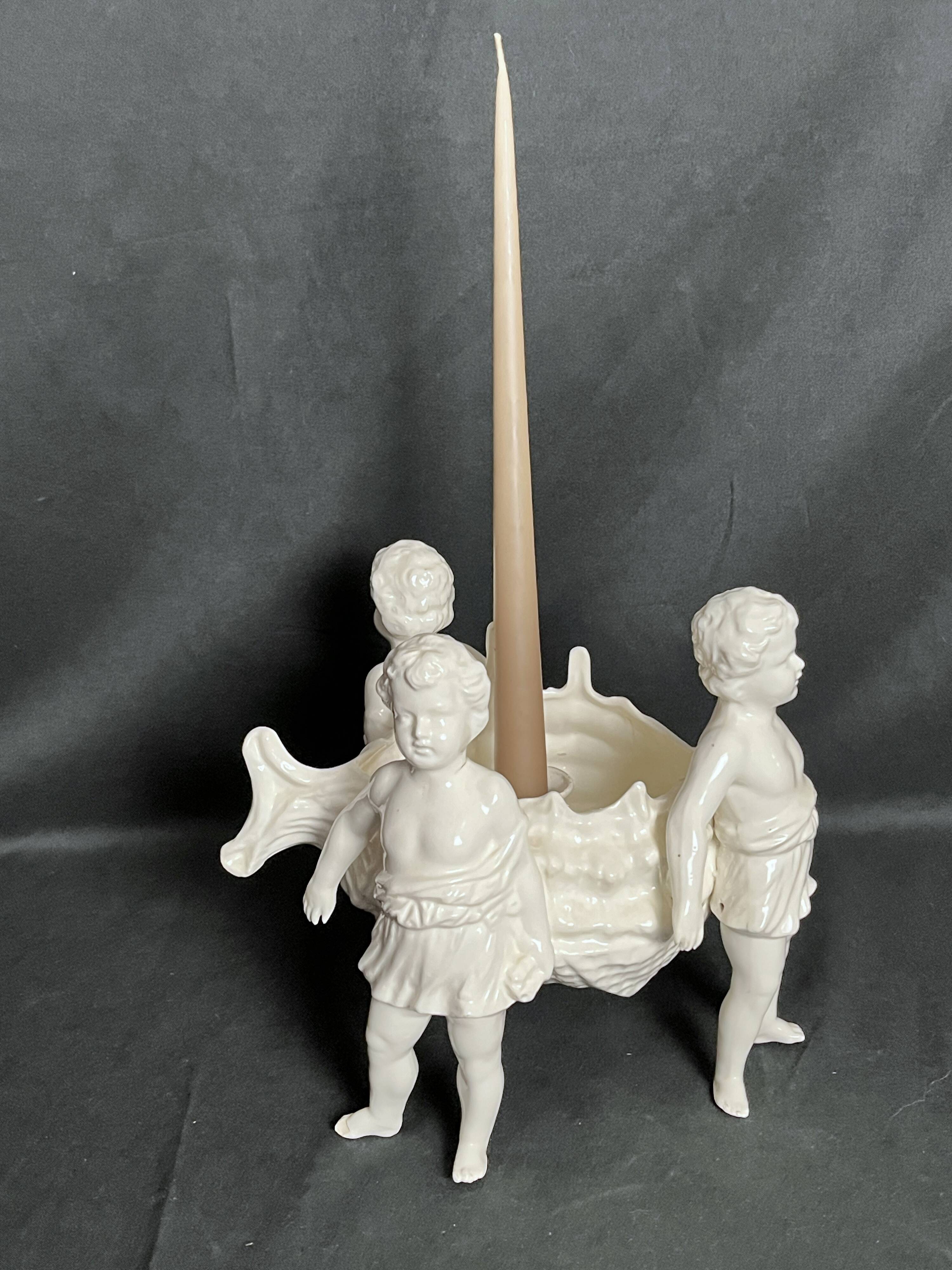 Porcelain, centerpiece with candle holder decorated with putti, 20th century