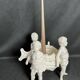 Porcelain, centerpiece with candle holder decorated with putti, 20th century