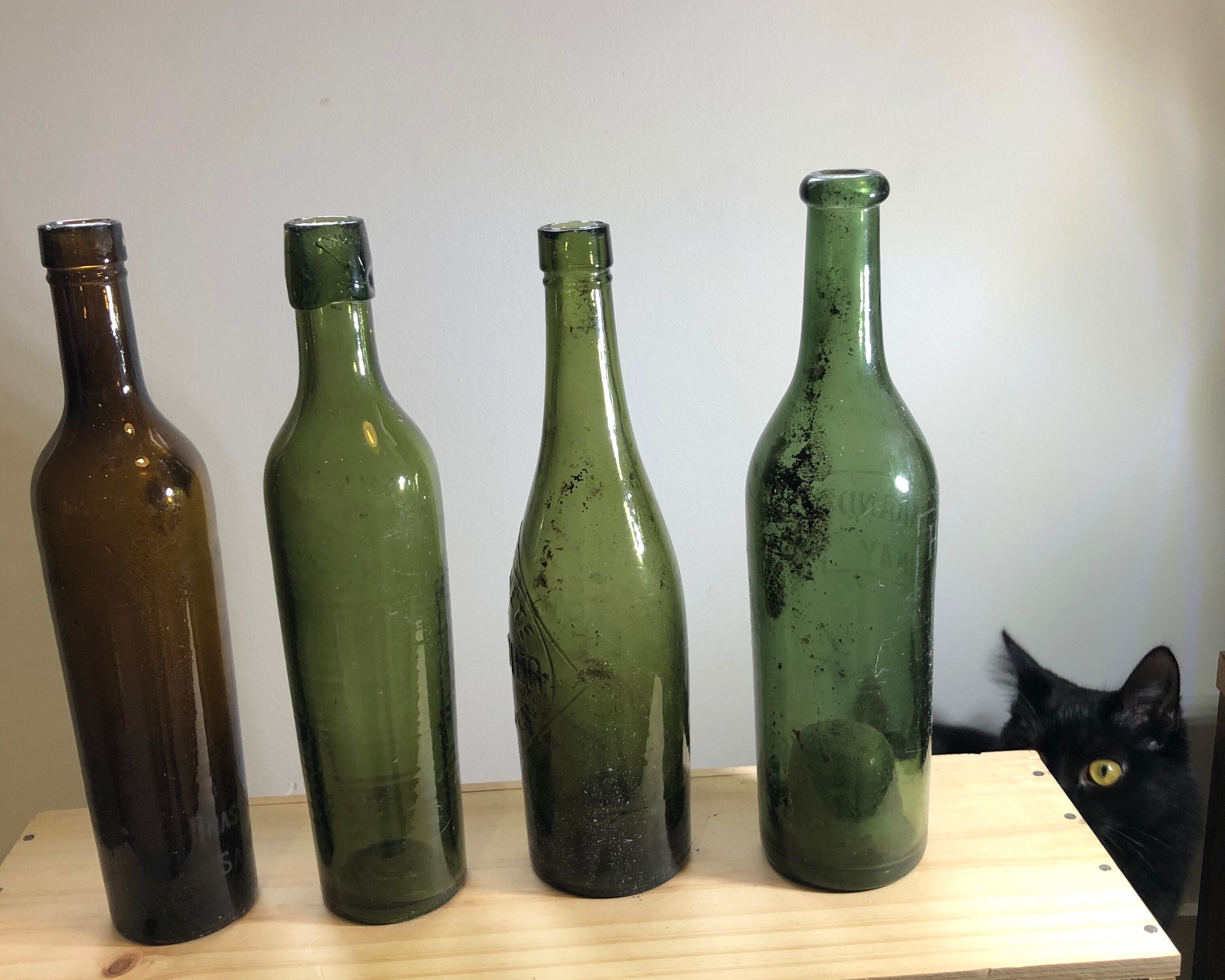Lot of old blown glass beer bottles with marking