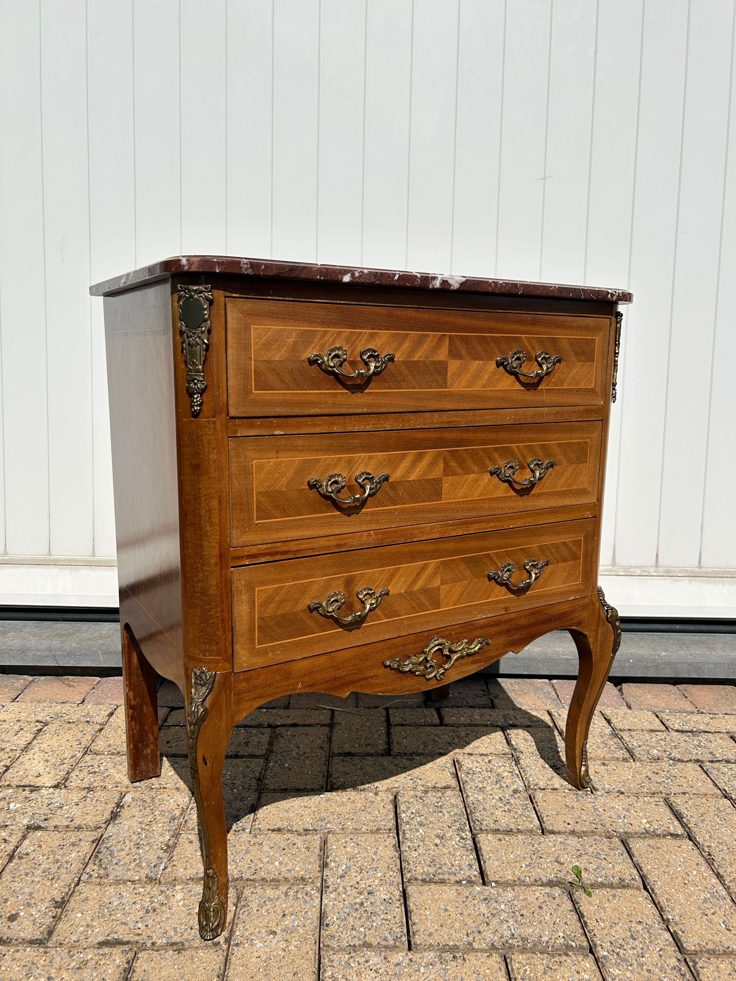 Marquetry commode in transitional style