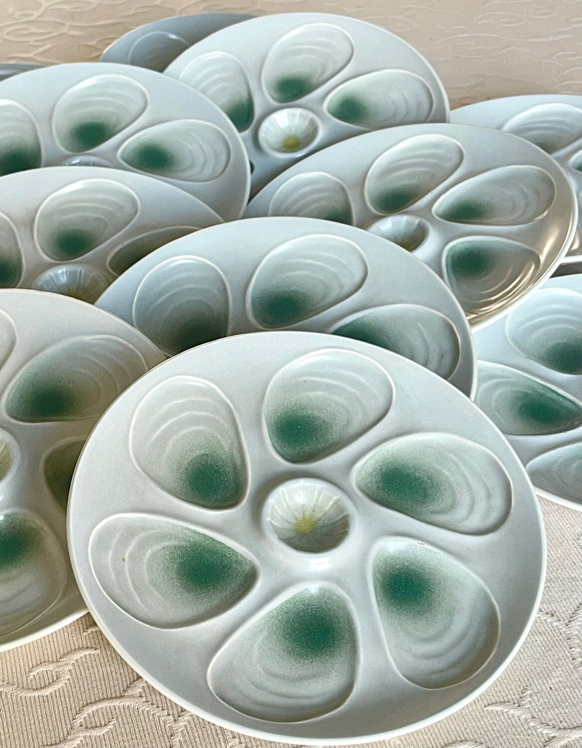11 oyster plates 1960.