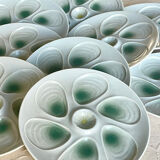 11 oyster plates 1960.