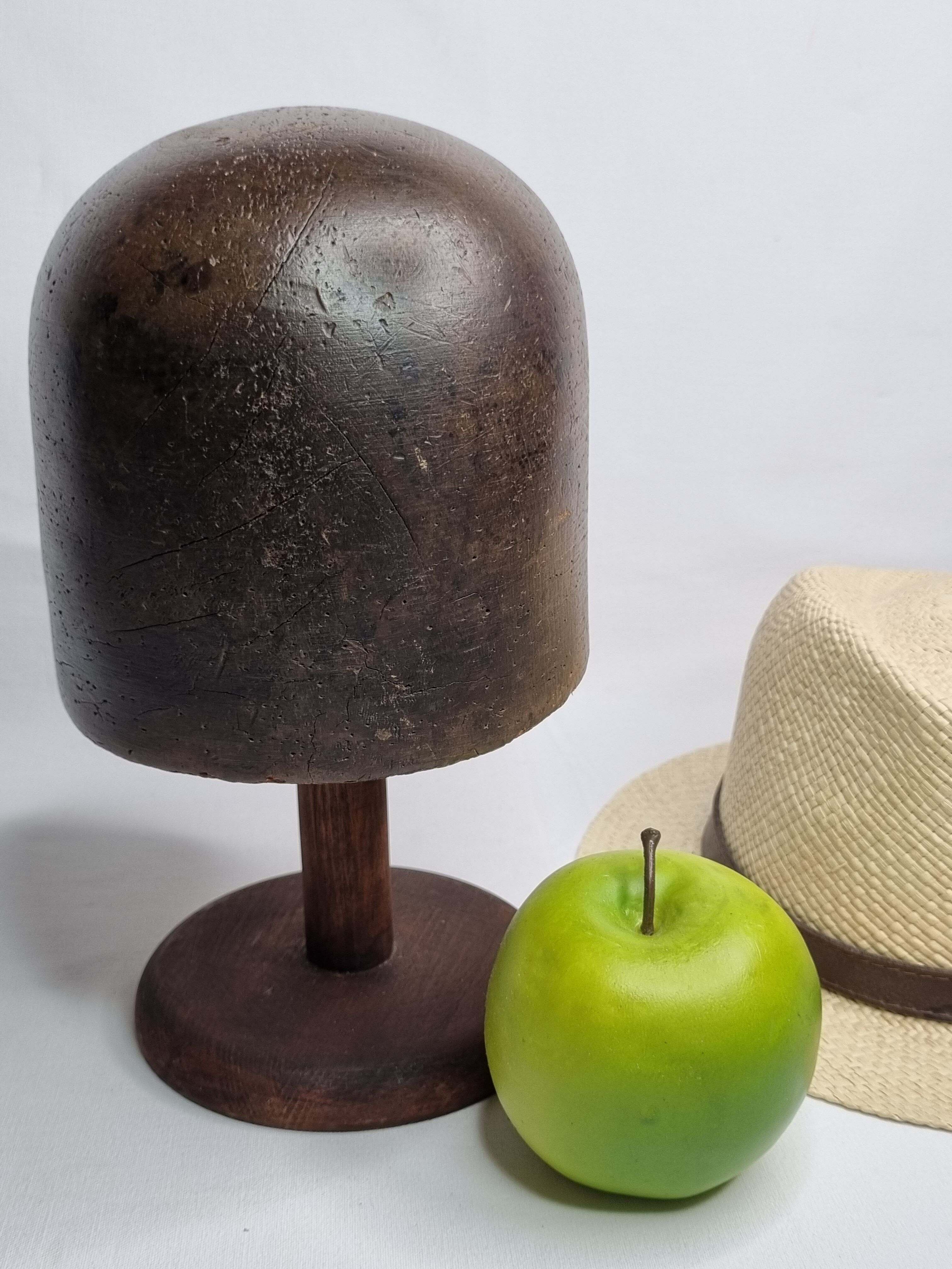 Old solid wood hat shape on foot, 1900