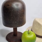 Old solid wood hat shape on foot, 1900