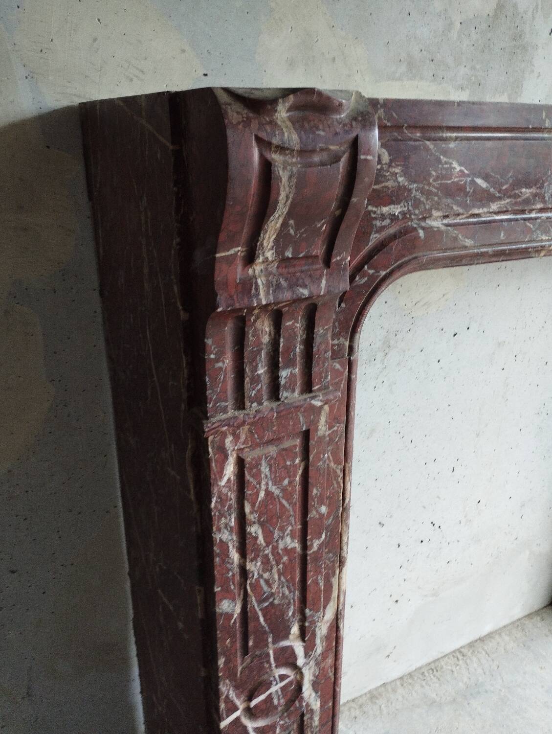 Old Louis XV red marble fireplace