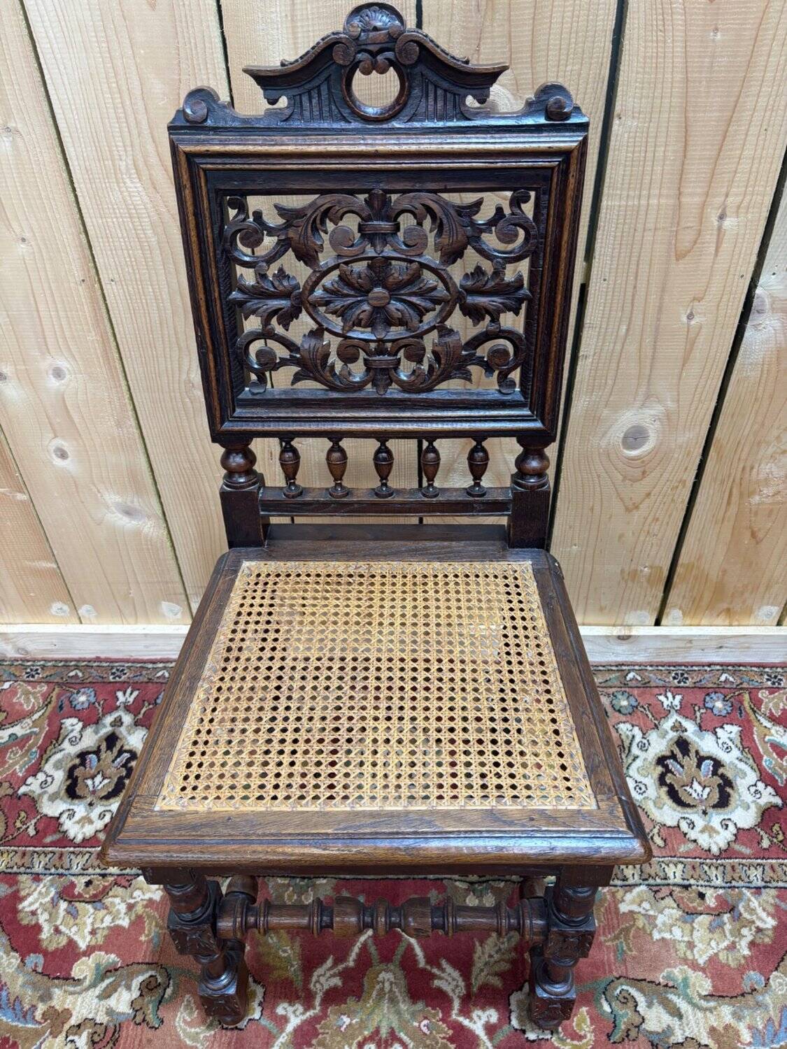 6 High Era chairs in carved solid oak and rattan caning.
