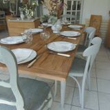 Farmhouse table with pearl gray base and raw wood top.
