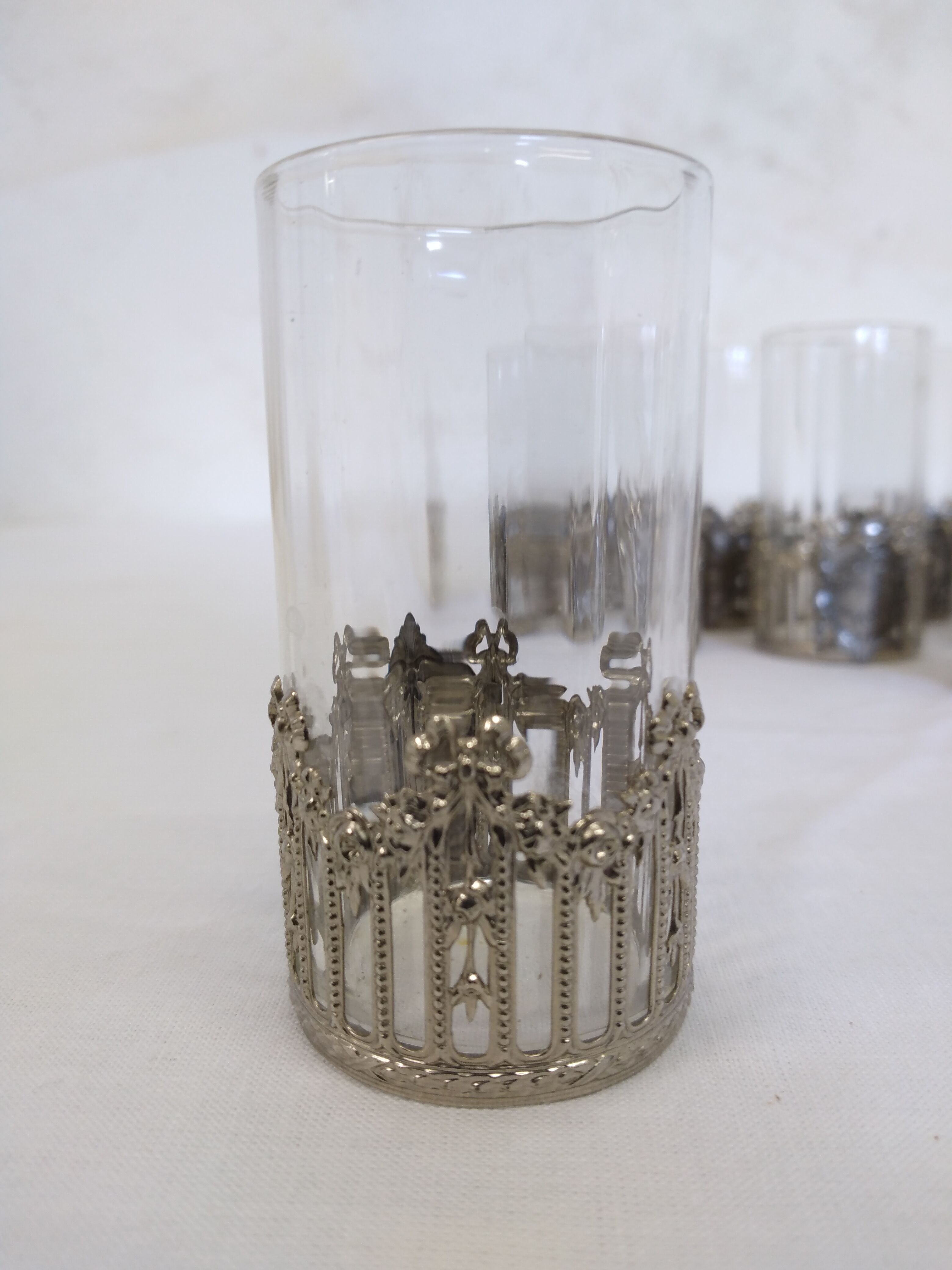 Glass with art deco strapping