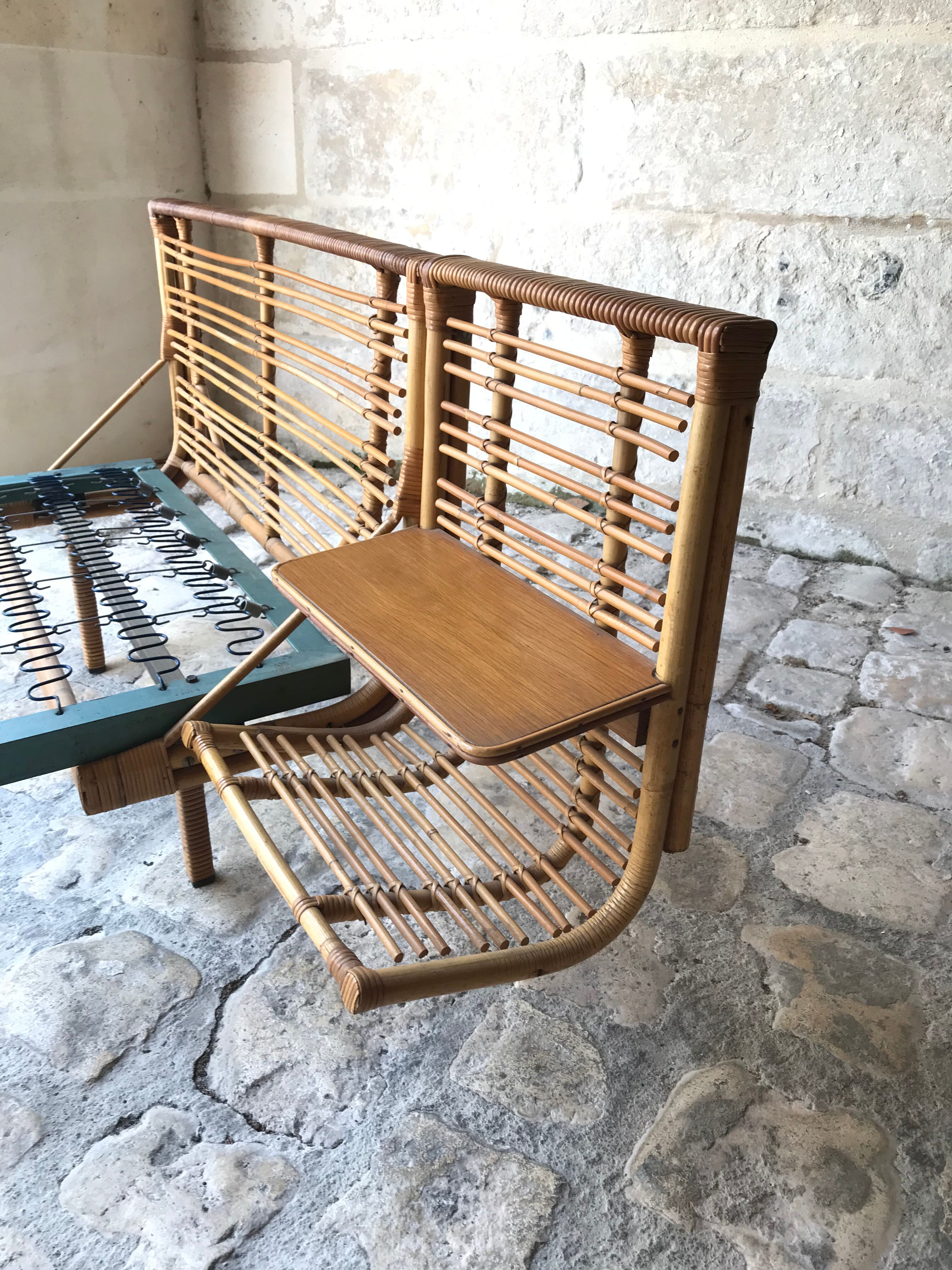 Twin rattan beds with built-in bedside tables