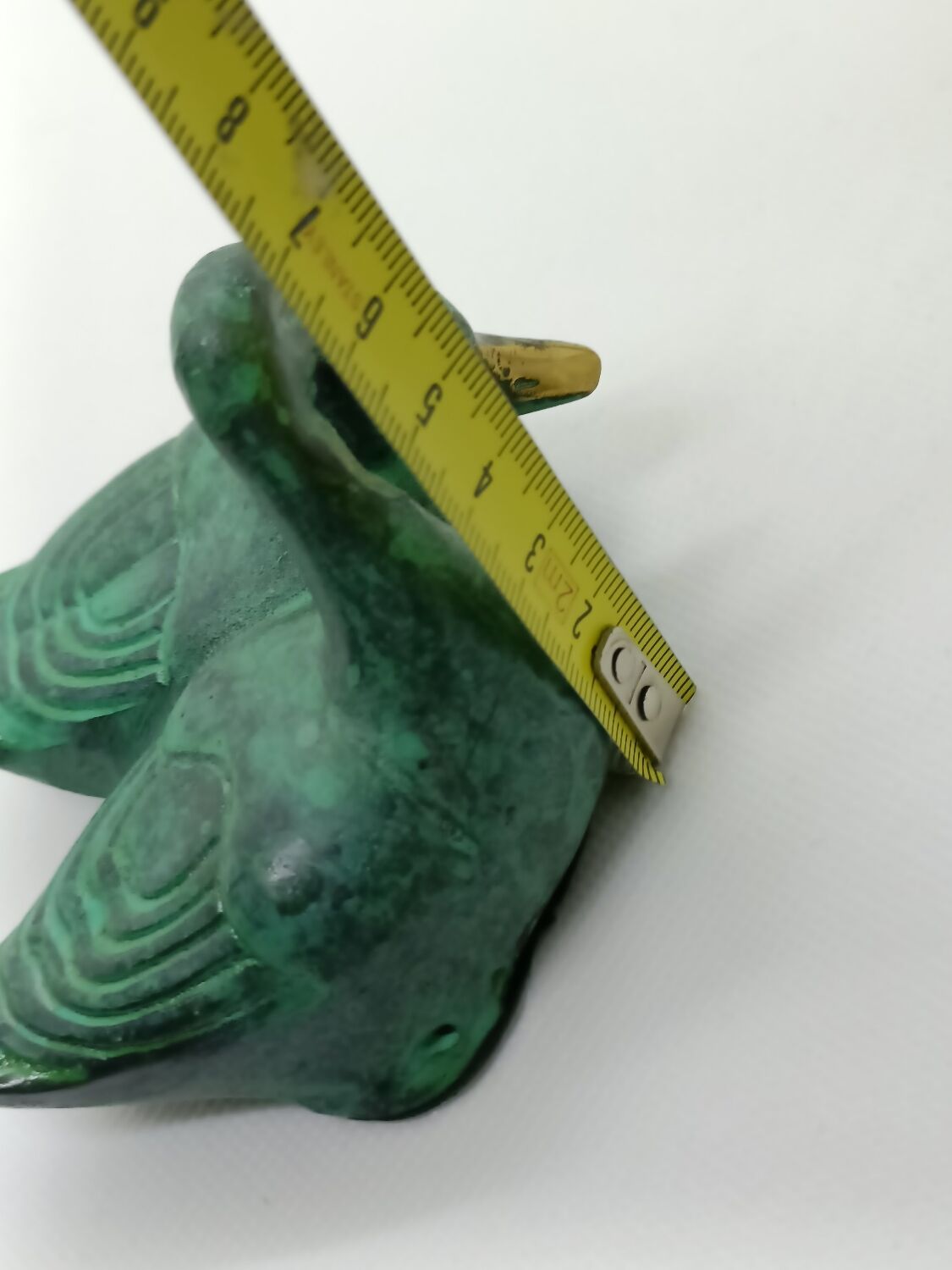 Two green and golden ducks in brass