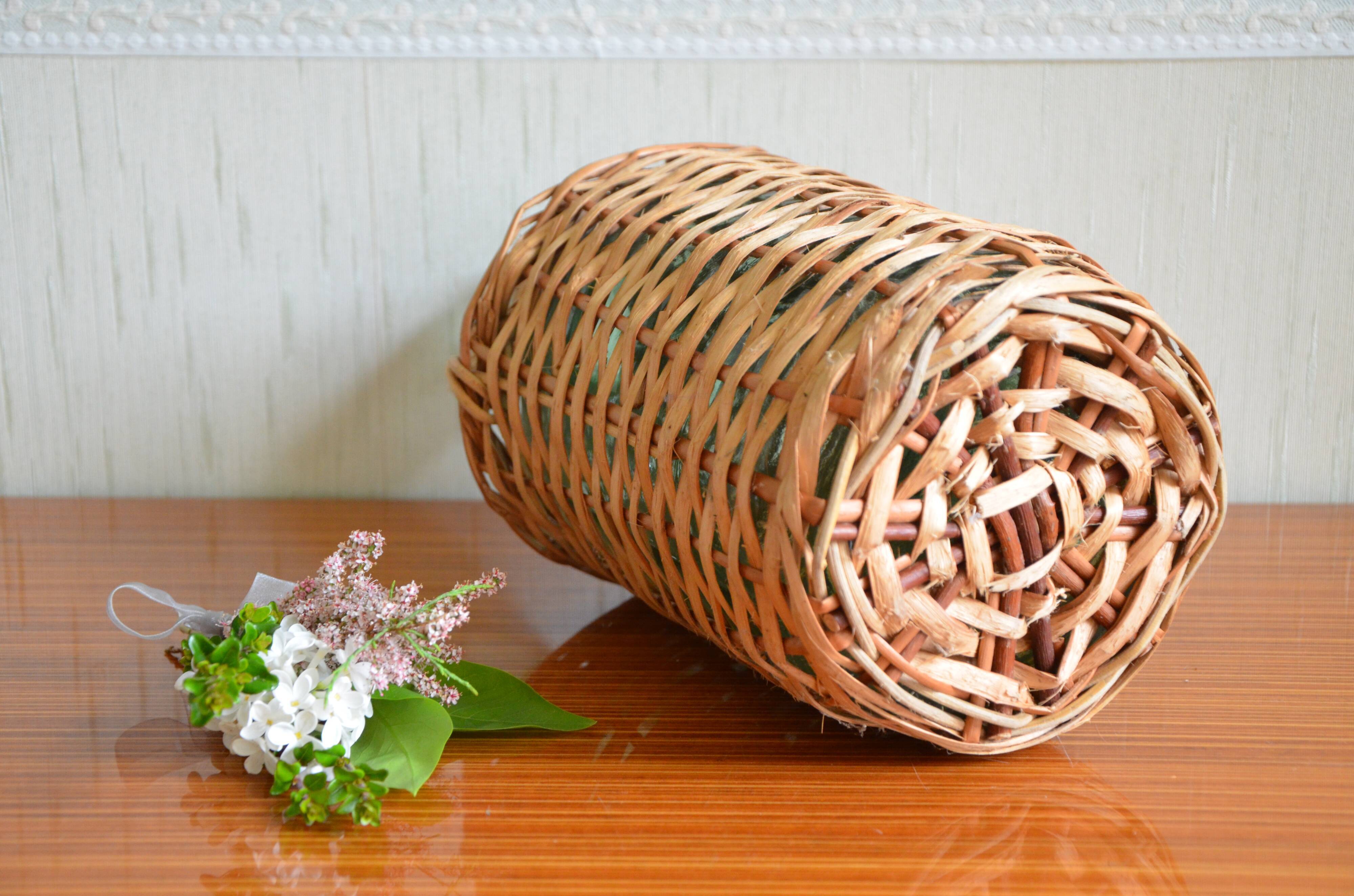 Viresa glass bottle and woven rattan