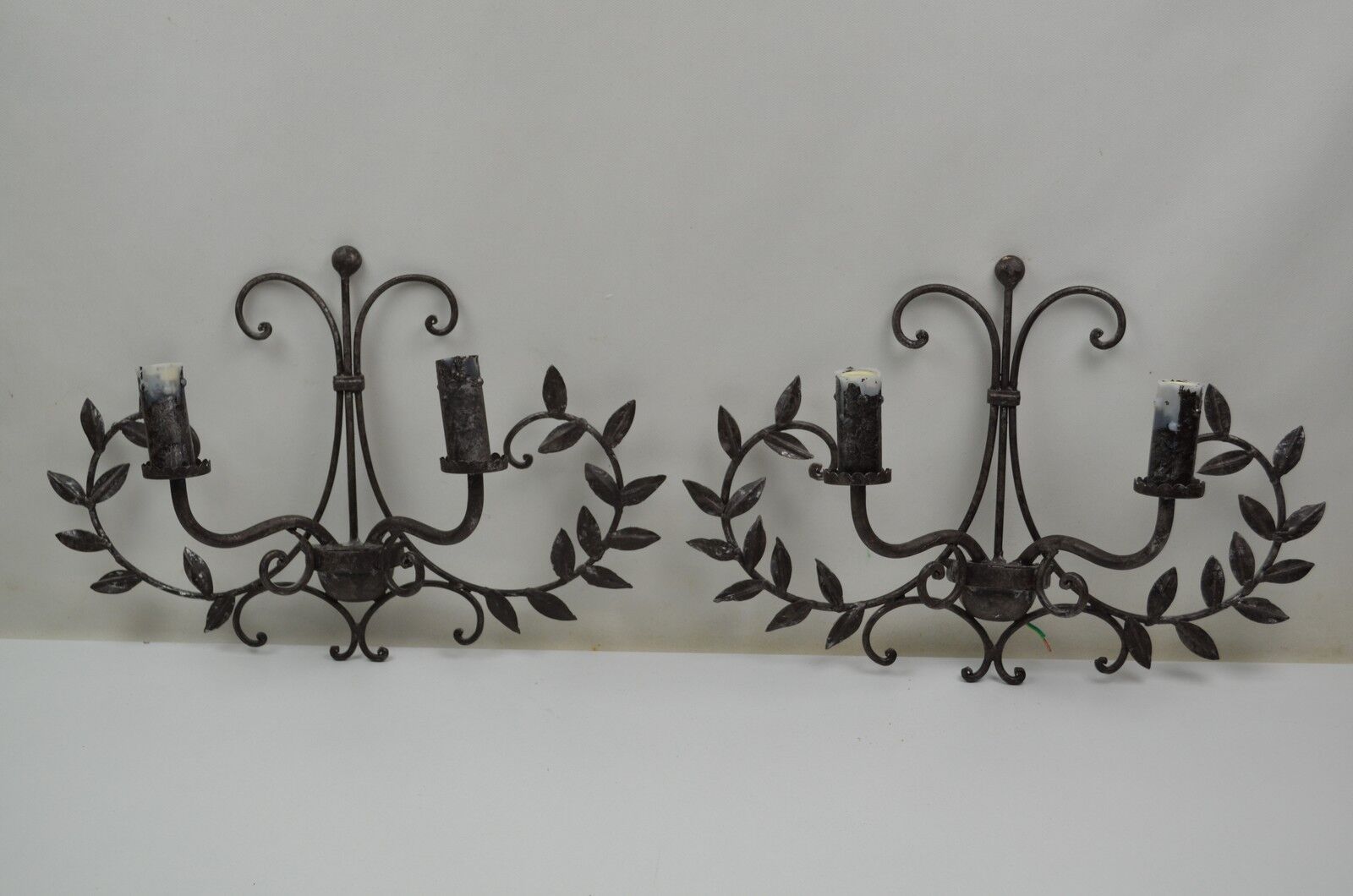 pair of grey patinated iron wall sconces