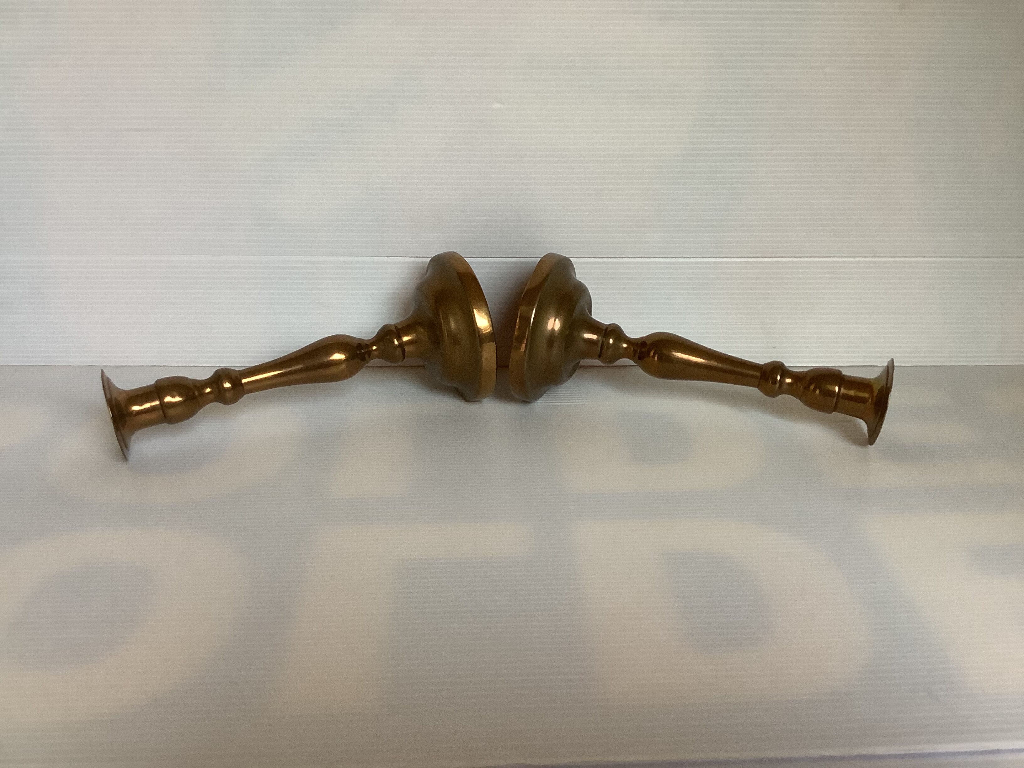 Pair of old brass candle holders