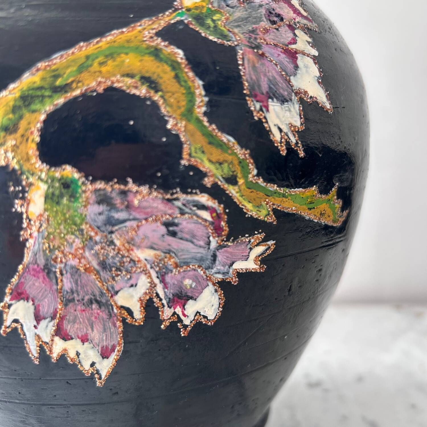 Black water jug with floral decoration