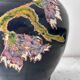 Black water jug with floral decoration