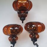 Three large vintage brown glass wall lights