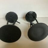 Pair of black metal candlesticks