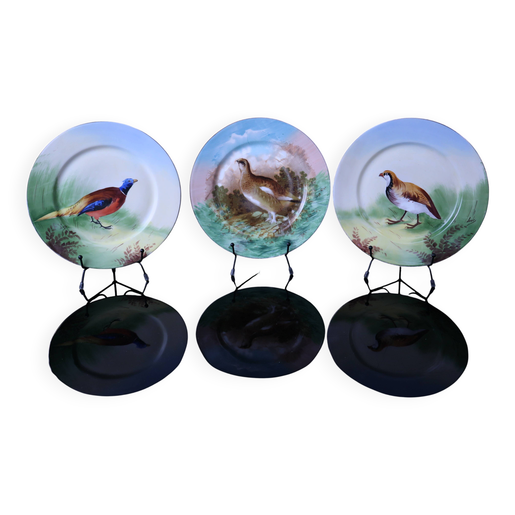 3 decorative porcelain plates from Limoges featuring partridges and pheasants.