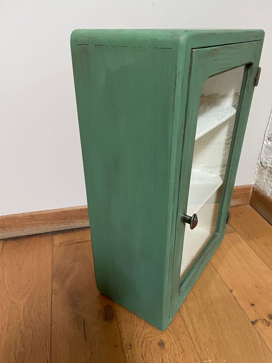 Small wooden cabinet patinated arsenic green