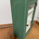 Small wooden cabinet patinated arsenic green