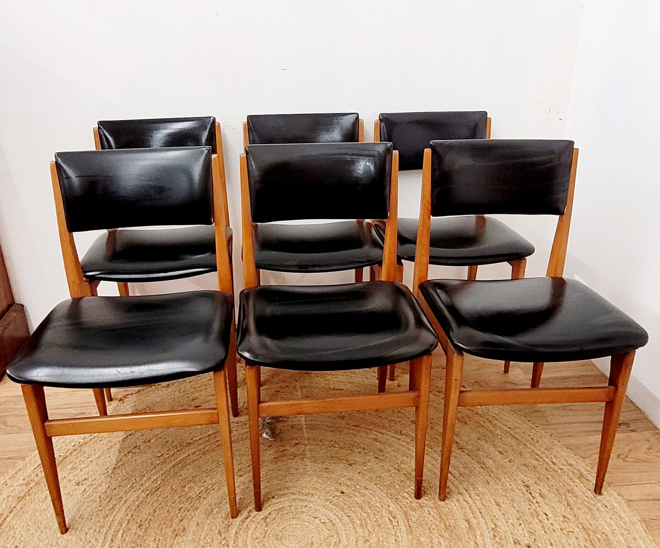 Six vintage wooden chairs and black Skaï