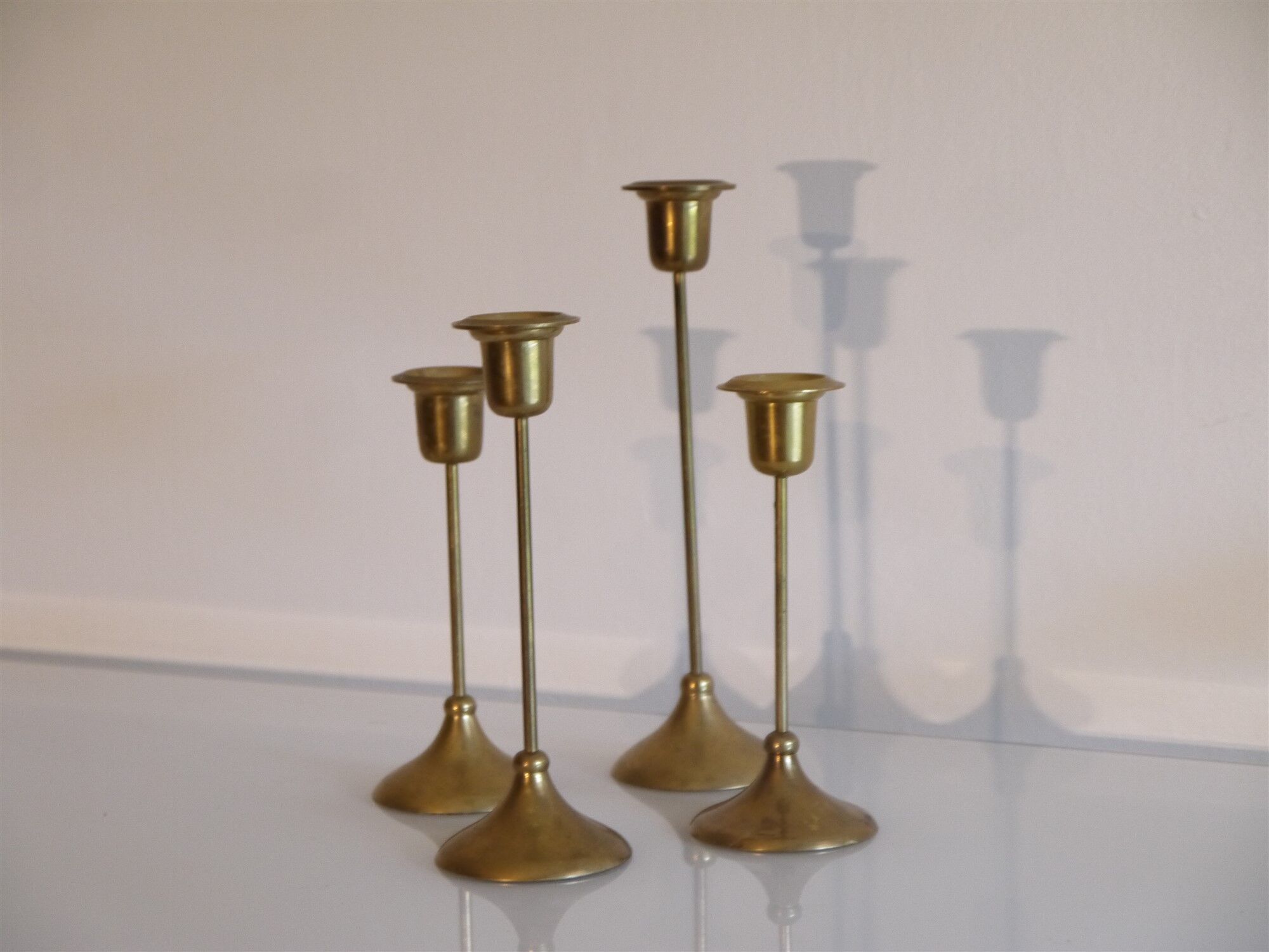 Batch of 4 vintage scandinavian brass candlesticks
