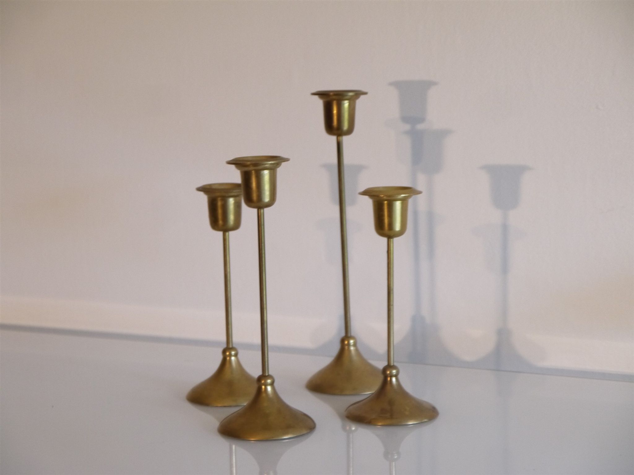 Batch of 4 vintage scandinavian brass candlesticks