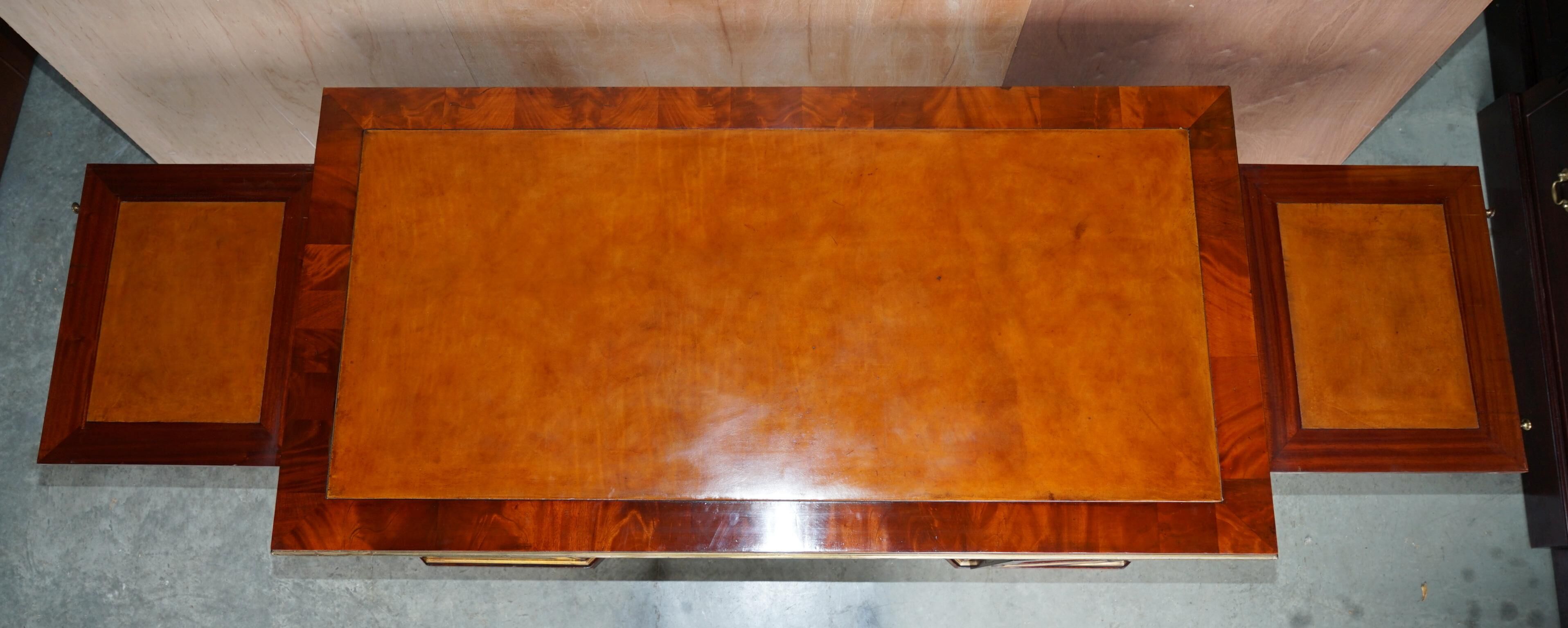 Restored antique Russian hardwood partner desk and leather armchair.