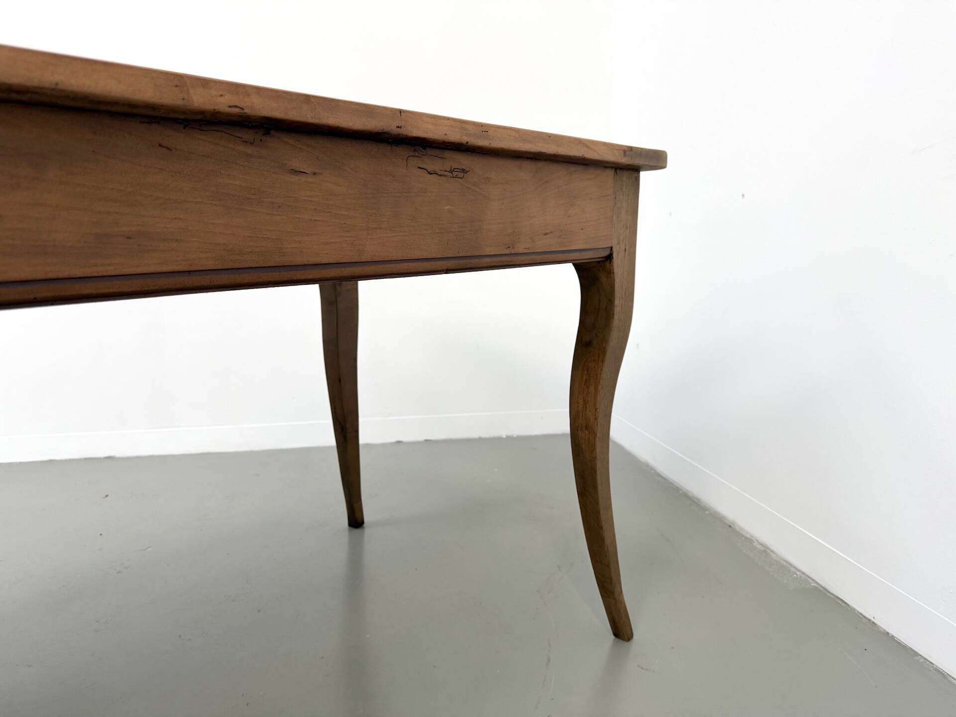 Farm table in solid cherry — Saber legs, Circa 1880