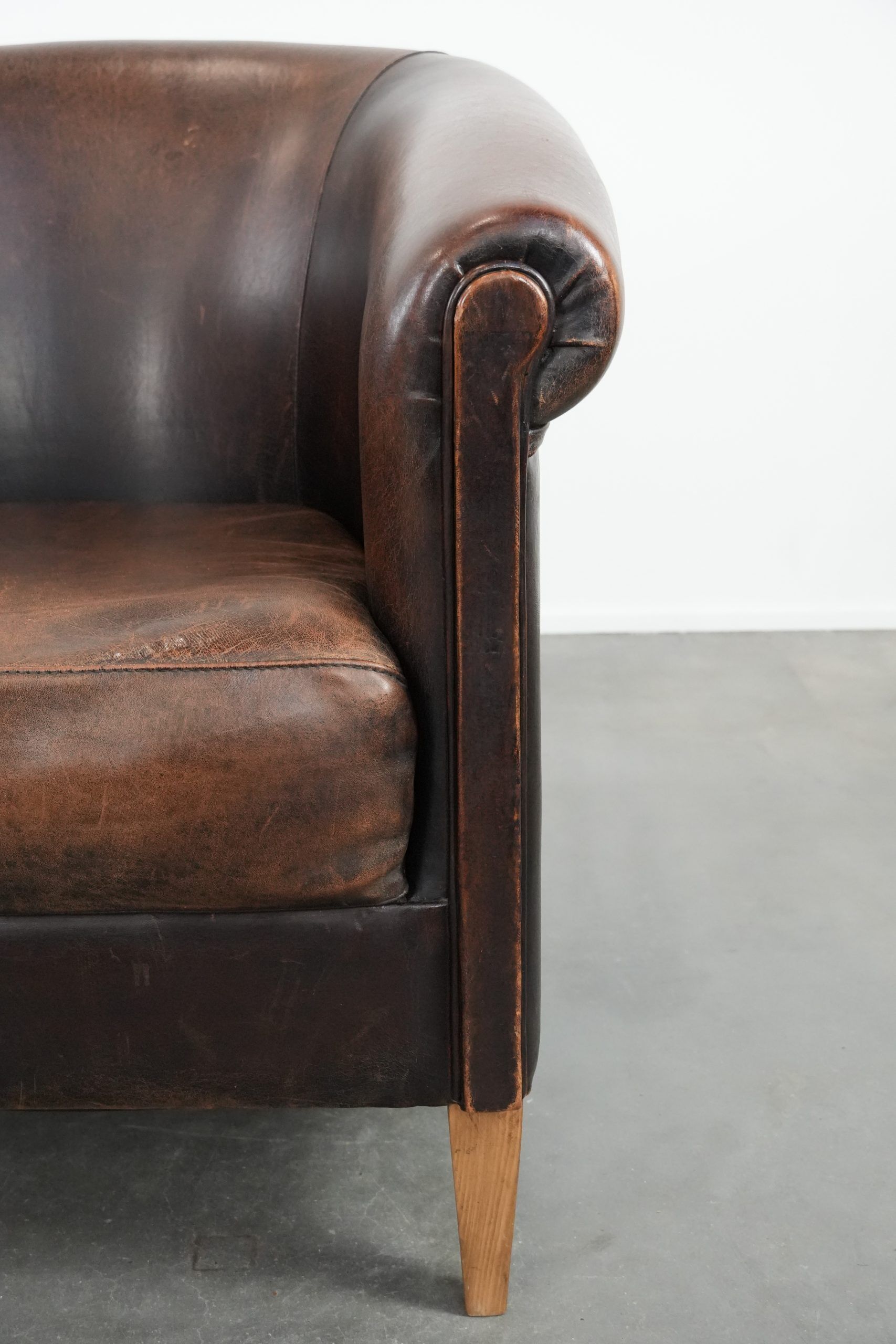 Characterful club armchair made of sheepskin with a beautiful patina