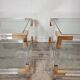 Set of 2 coffee tables in acrylic glass and brass, 1970s