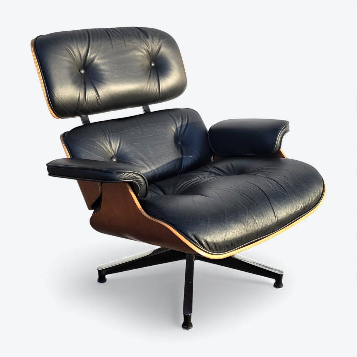 Fauteuil et repose-pieds Herman Miller Original Eames, noir et cerisier