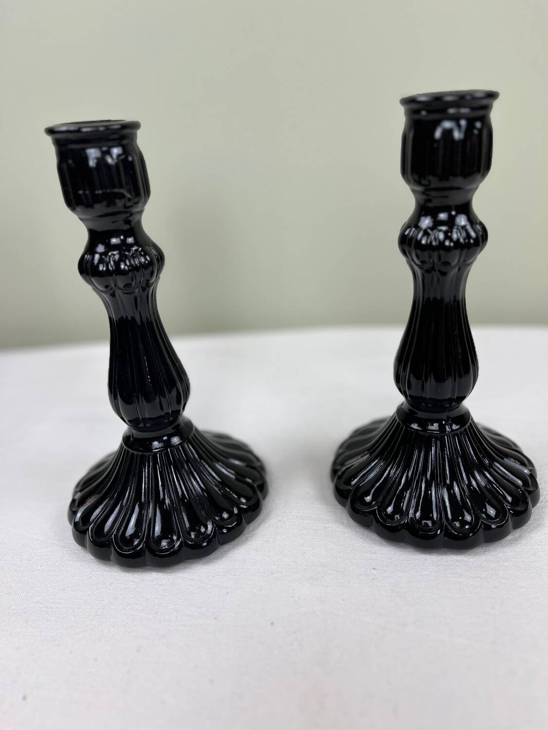 Pair of black opaline candlesticks