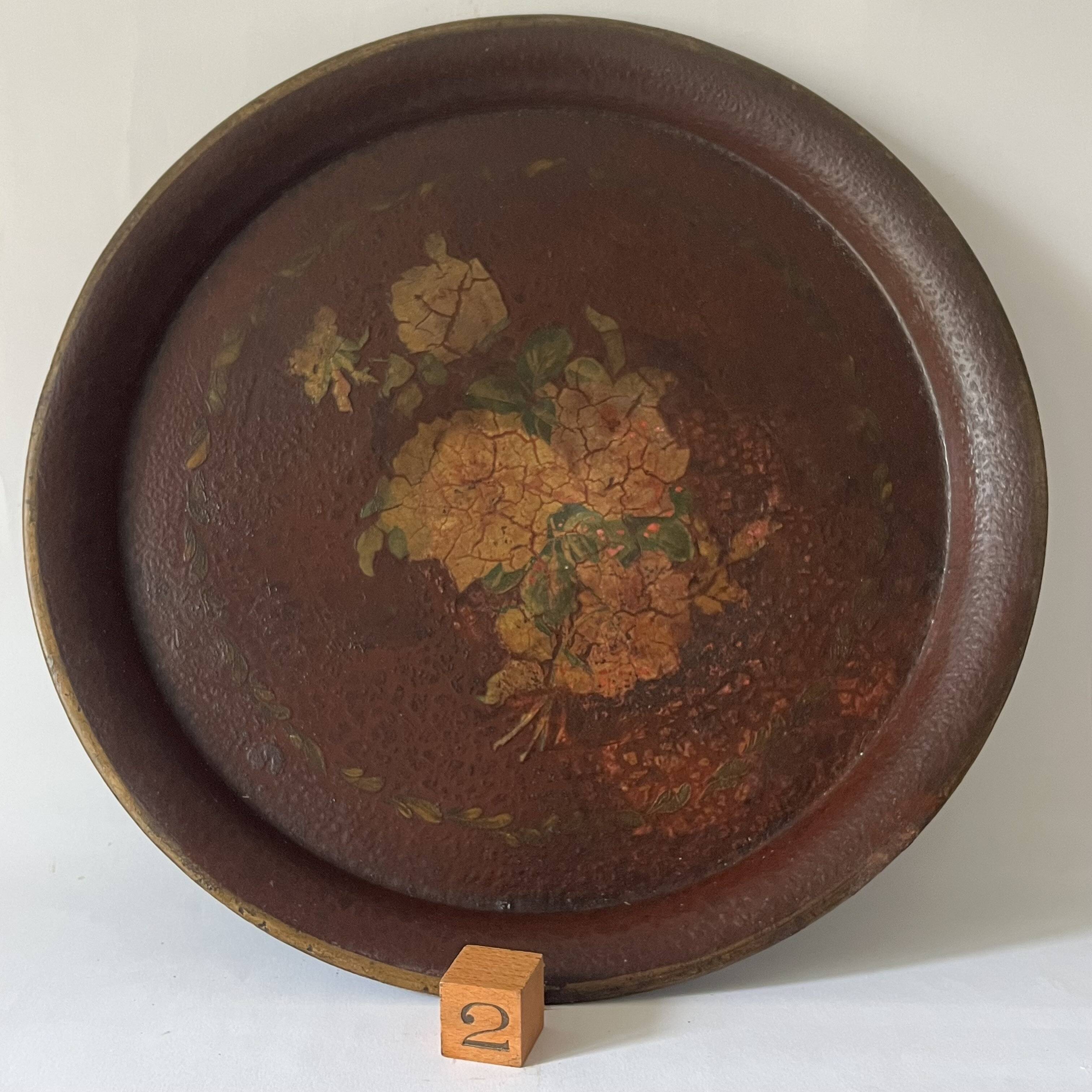 Two old trays on a stand/console.