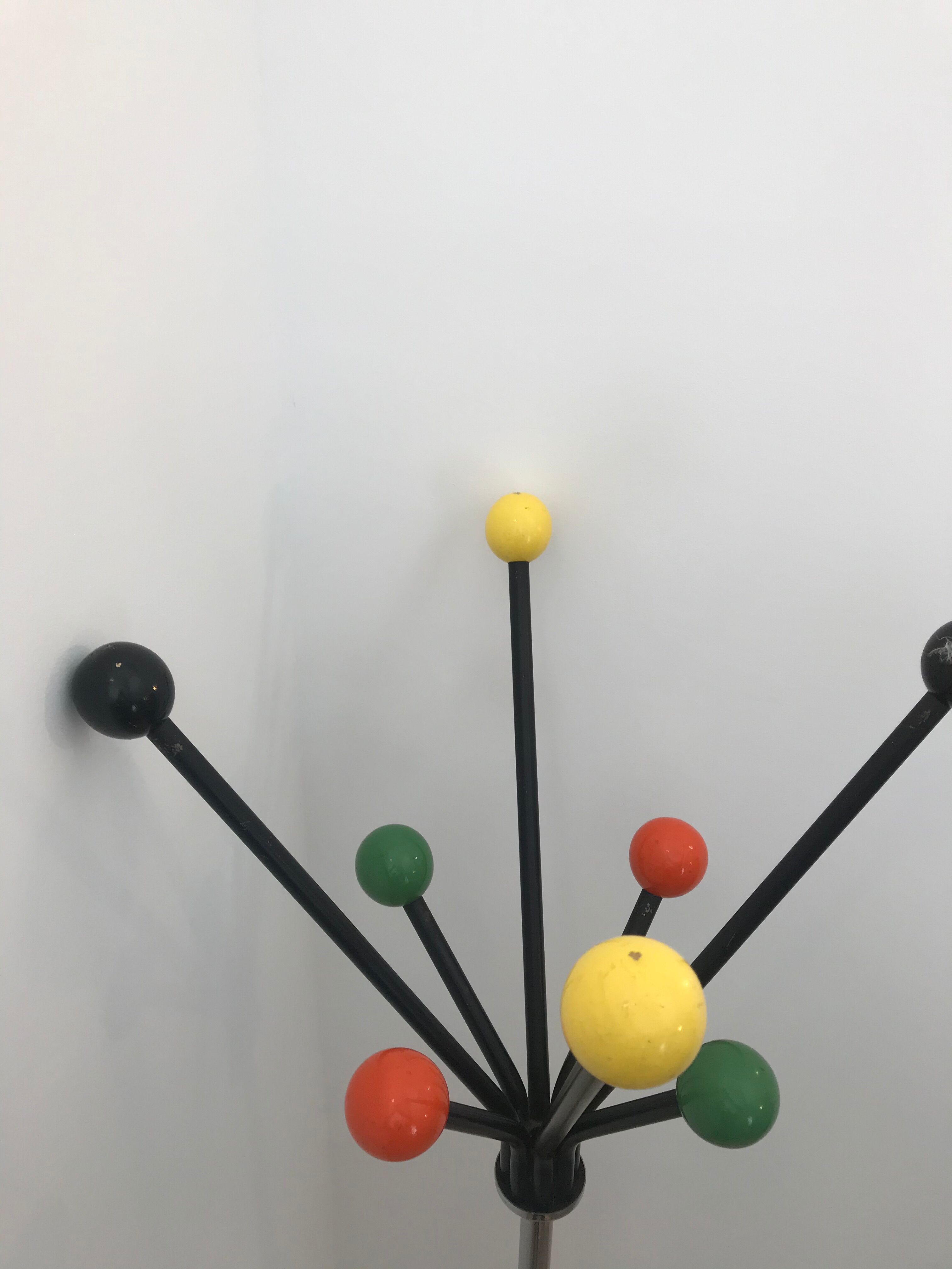 Wearing chrome parrot coat, black and multicolored balls