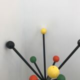 Wearing chrome parrot coat, black and multicolored balls